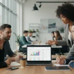 Entrepreneurs analyzing business banking solutions on a laptop in a modern co-working space.